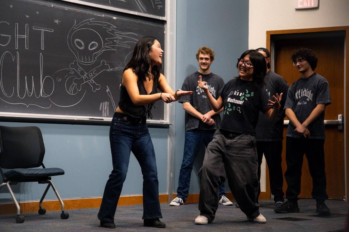 Two performers mid-scene at an improv show